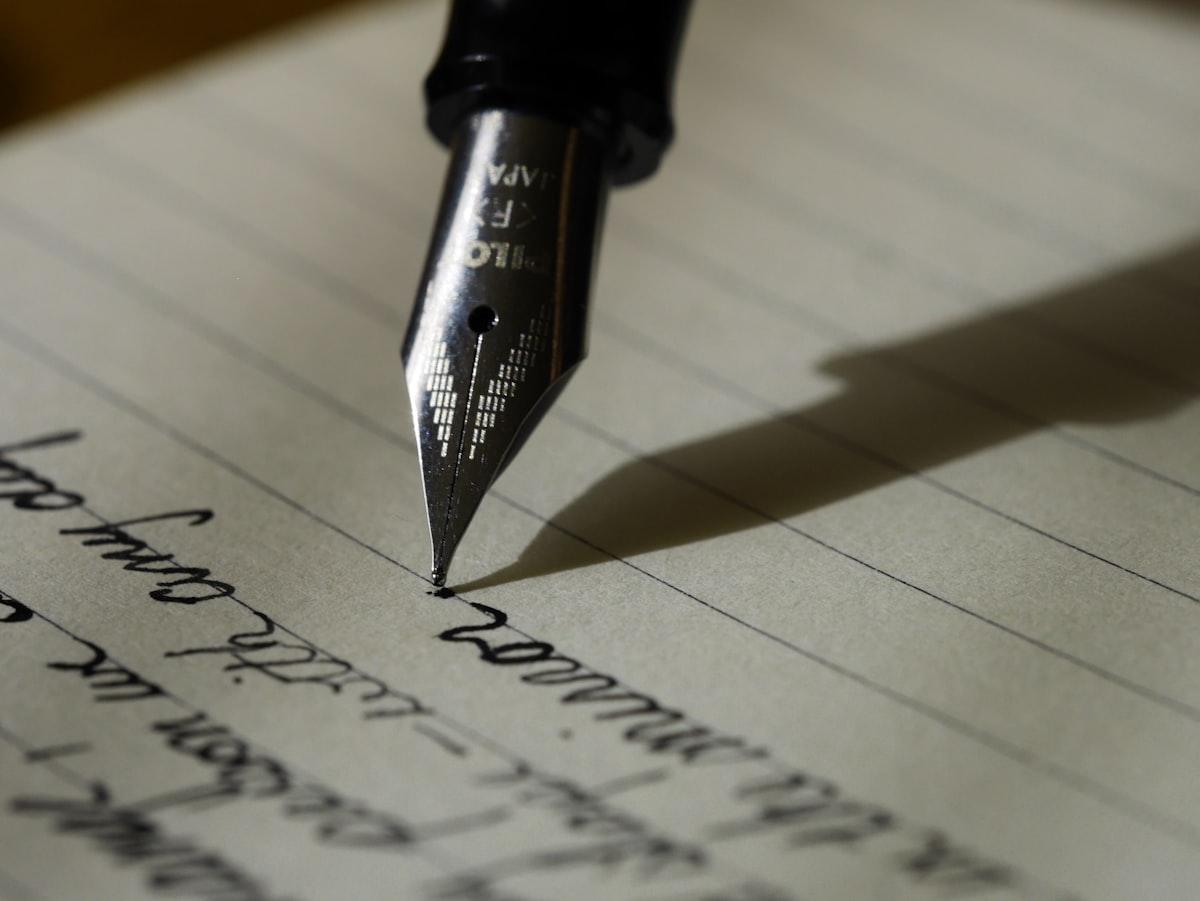 Fountain pen on correspondence during a detailed financial review