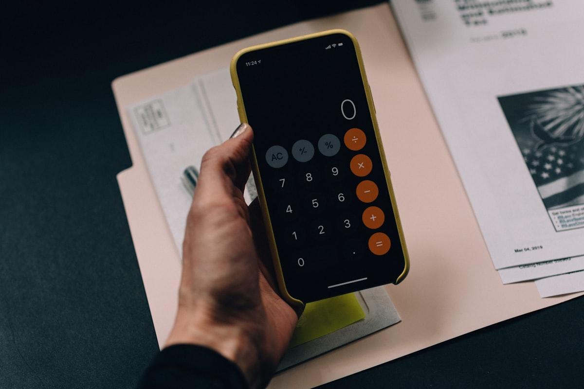 Financial papers and calculator used in litigation advisory work